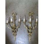 A pair of good quality brass three branch wall lights, 68cm high