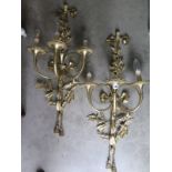 A pair of brass three branch wall lights - 84cm high