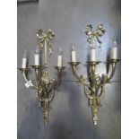 A pair of good quality brass three branch wall lights, 68cm high