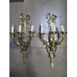 A pair of good quality brass three branch wall lights, 68cm high