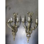 A pair of good quality brass three branch wall lights, 68cm high