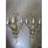 A pair of good quality brass three branch wall lights, 68cm high