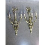 A pair of good quality three branch wall lights, 68cm high