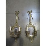 A pair of good quality brass two branch wall lights with mirrors 74cm high