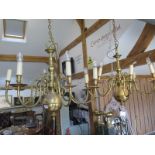 A pair of Dutch style brass eight-light chandeliers - 62cm tall, 75cm wide
