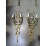 A pair of good quality brass three branch wall lights, 87cm high