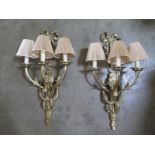 A pair of good quality brass three branch wall lights, 68cm high