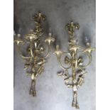 A pair of good quality brass three branch wall lights, 86cm high