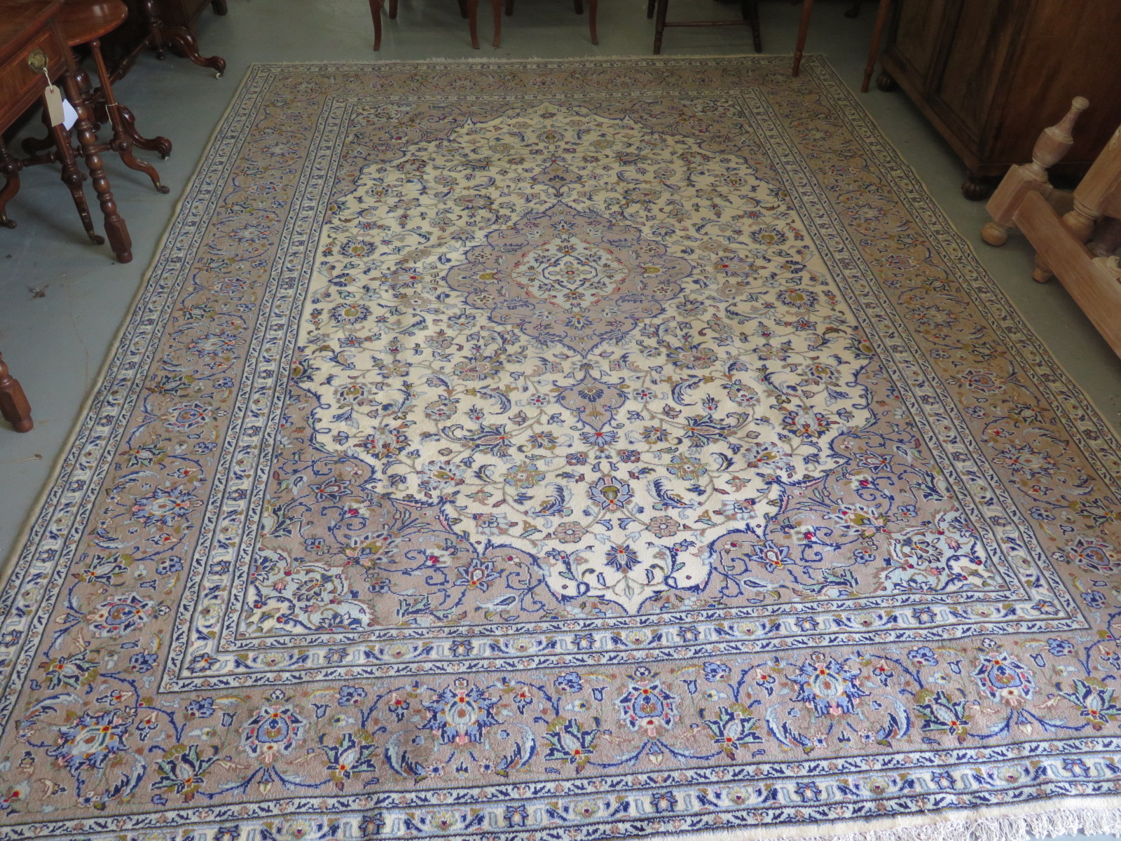 A hand knotted woollen kashan rug - 342cm x 250cm