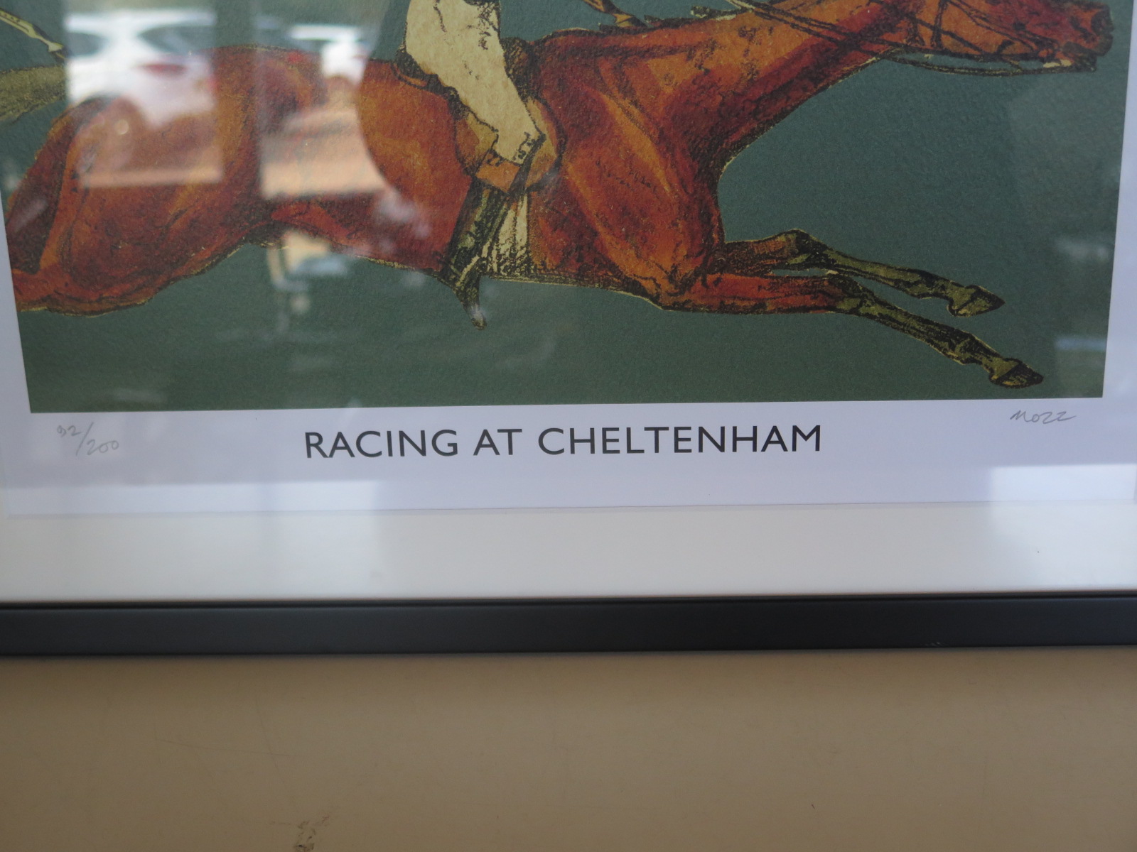 A framed limited edition print, racing at Cheltneham, signed Mozz numbered 92/200 - size 51cm x 68cm - Image 2 of 2