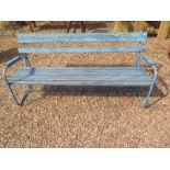 An early 20th century rustic garden bench with original distressed paint, comprising wooden slats on