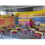 Thirteen matchbox superfast cars with boxes and racetrack SF-5 and SF-4 and an Impy Ford estate -