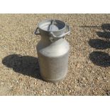 A vintage aluminium milk churn. Ideal for use as an occasional or lamp table, or for decorative