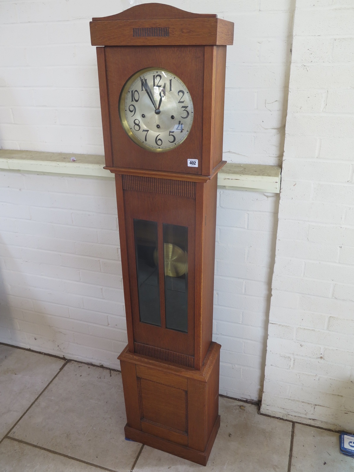 An oak chiming spring driven Granddaughter clock, 167cm tall, running order