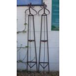 A pair of wrought iron triangular section garden obelisks with scroll finials - 230cm H x 37cm W
