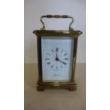 A brass carriage clock by Bayard, working 12cm tall