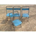 A set of four folding metal industrial chairs in original blue paint, stamped with makers name -