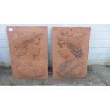 A pair of Renaissance style terracotta garden wall plaques, 46cm H x 29cm W