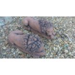 A pair of cast stone terracotta coloured recumbent lions on rectangular bases, after Canova - 45cm L