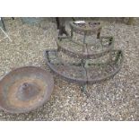 A garden metal three tier pot stand and a Mexican hat planter