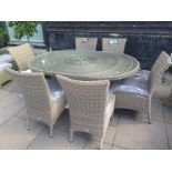 A Bramblecrest Sahara oval table 170cm long and six chairs with cushions - ex display