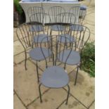 Eight metal stacking cafe chairs