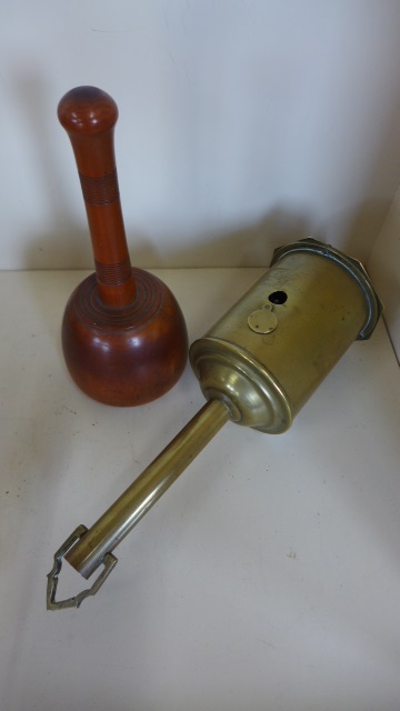 A clockwork brass spit and a mallet