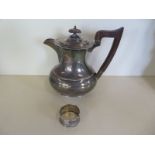 A silver water jug and a silver serviette ring, total weight approx 15 troy oz