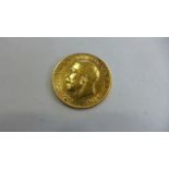 A George V 1911 gold half sovereign, approx 3.8grams, in good condition