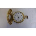 An 18ct gold half hunter pocket watch with engraved base, metal back plate, not working, crack to