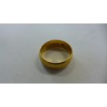 A 22ct gold ring, size K, approx 5.8g, in good condition but with some light surface wear