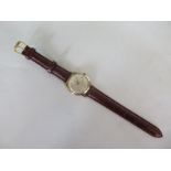 An Avia 9ct gold 17 jewel wristwatch - 33mm wide including button, generally good, running order,