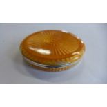 A silver and enamel pill box in oval form, approx 6.5cm wide, approx 21oz, with some damaged areas