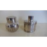 Two silver tea caddies oval shaped, one Birmingham 1912/13 - S and Co, the other Sheffield 1887 TB