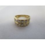 An 18ct yellow gold double row diamond ring, set with fourteen diamonds, size K, approx 8.4 grams,