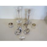 A silver pill box approx 0.6 troy oz, together with a silver candlestick with weighted base and