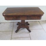 A 19th century mahogany and rosewood tea table on a quatrefoil base with claw feet - 104cm wide,