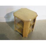 A light oak octagonal side table - 51cm tall x 45cm