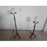 Two forged iron pricket stands, tallest 76cm