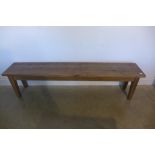 A rustic pine bench - 48cm tall x 188cm x 34cm