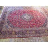 A hand knotted woollen Kashan rug - 332cm x 260cm in good condition