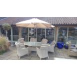 A Bramblecrest Ascot 175cm elliptical dining set with parasol and six chairs and cushions - small