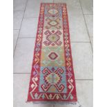 A hand knotted vegetable dye wool Chobe Kelim runner, approx 193cm x 58cm - in good condition