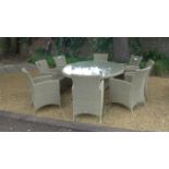 A Bramblecrest Cotswold 220cm elliptical table with eight Cotswold armchairs with cushions, ex-