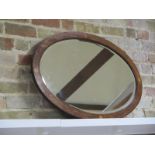 An oval mirror with inlaid wood frame, in good condition, no marks to glass, 90cm x 60cm