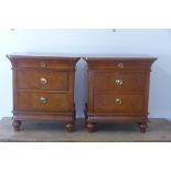 A pair of 20th century cherry wood three drawer bedside chests - 66cm H x 62cm x 36cm