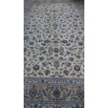A hand knotted, woollen Kashan rug, approx 402cm x 280cm, in good condition
