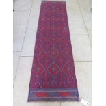 A hand knotted woollen Meshwani runner, approx 250cm x 64cm - in good condition