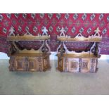 A pair of carved oak Greenman wall shelves with cupboards, 61cm tall x 59cm x 15cm