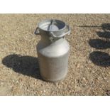 A vintage aluminium milk churn. Ideal for use as an occasional or lamp table, or for decorative